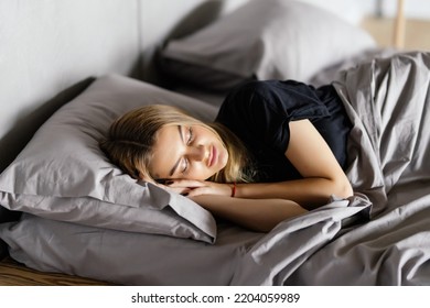 Young Woman Sleep In Bed