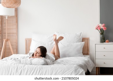 Young Woman Sleeping In Bedroom