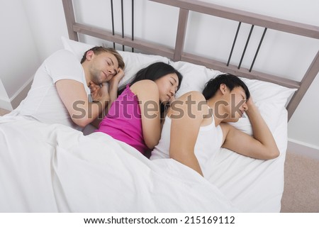 [Image: young-woman-sleeping-two-men-450w-215169112.jpg]