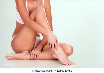 Young woman with slim body and smooth clean skin. Laser hair removal concept