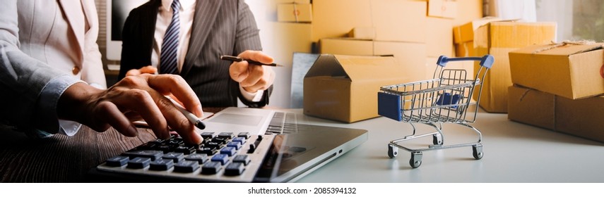 Young woman small business owner online shopping at home. taking note of orders from customers with mobile phones. SME entrepreneur or freelance life style concept. - Shutterstock ID 2085394132