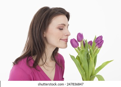 Young Woman Smelling Flowers