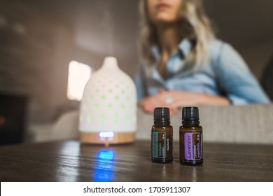 Young Woman Smelling Her Essential Oil Diffuser