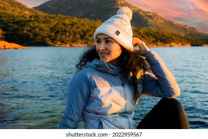 A Young Woman Smile With A Perfect  Teeth In Tropical Winter With The Beach And Mountains  In The Background. Portrait Photography