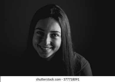 Young Woman Smile. Studio. Black And White. High Contrast