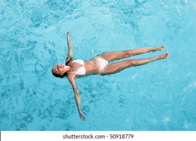 Young Woman Smiles, Swiming In Ocean, Maldives