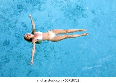 Young Woman Smiles, Swiming In Ocean, Maldives