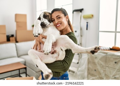 Young woman smiling confident hugging dog at home - Shutterstock ID 2196162221