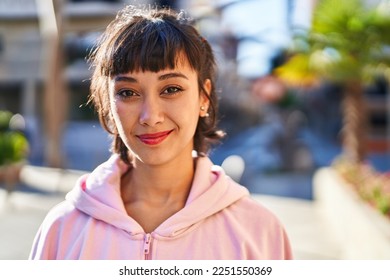 Young woman smiling confident standing at street - Powered by Shutterstock