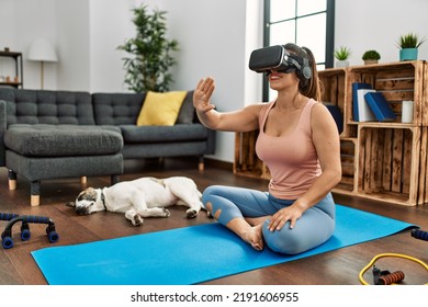 Young Woman Smiling Confident Training Using Vr Goggles At Home