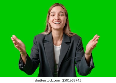 Young Woman Smiling and Gesturing in Front of Green Screen - Powered by Shutterstock