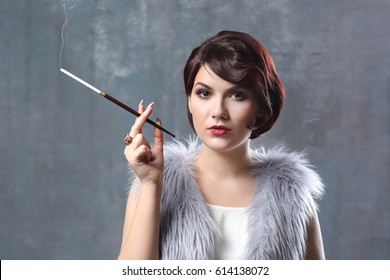 Young Woman Smoking Cigarette Holder On Stock Photo 614138072 ...