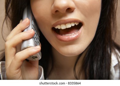 young woman is speaking on cell phone - Shutterstock ID 8335864