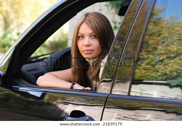 Young woman in Sport\
Utility Vehicle