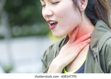 Young Woman In Sportswear Suffering From Chronic Cough