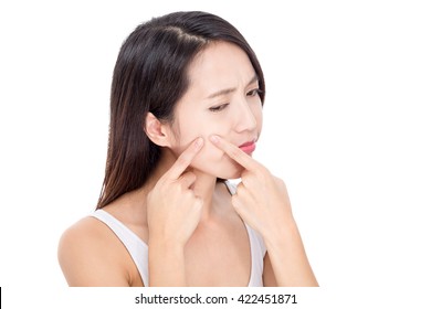 Young Woman Squeezing Pimple