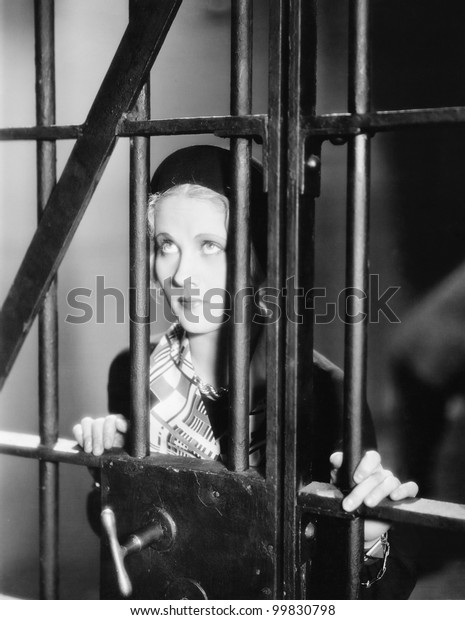 Young Woman Standing Behind Bars Prison Stock Photo (Edit Now) 99830798