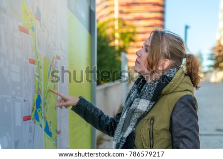 Similar – Image, Stock Photo Twin sisters laughing at a postcard in Erfurt