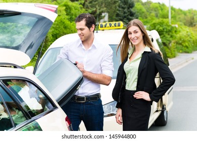 Young woman standing in front of taxi, she has reached her destination, the taxi driver will help with the luggage