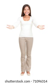 Young woman standing gesturing a welcome sign with open arms. Greeting gesture on white background. Multiracial Caucasian Asian natural beauty in full length.