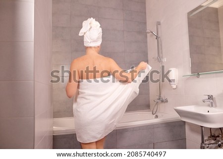 Similar – Image, Stock Photo Woman standing in shallow water with bare legs talking to her dog
