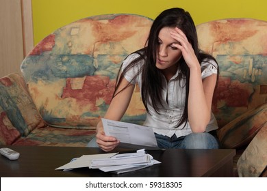 A Young Woman Stressed Because Of Bills.