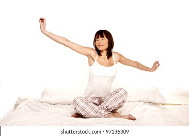 A Young Woman Stretches As She Wakes Up From A Good Nights Sleep. Waking Up.