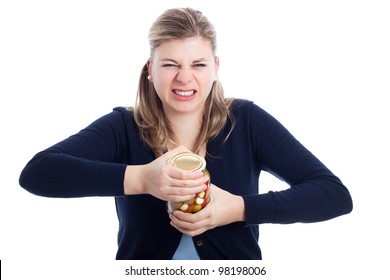 Young woman struggling to open bottle, isolated on white background.