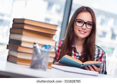 Young woman student preparing for college exams