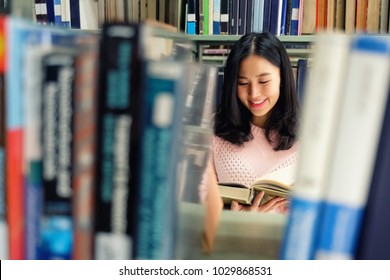 Young Woman Studying In Library