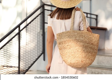 Young Woman With Stylish Straw Bag Outdoors, Closeup