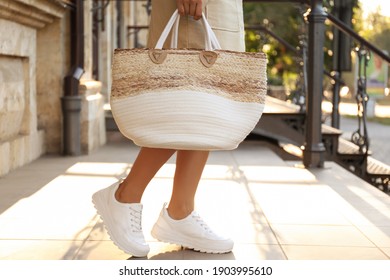 Young Woman With Stylish Straw Bag Outdoors, Closeup