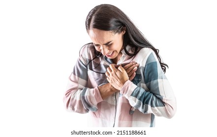 Young woman with a sudden heart attack, holding her chest tightly in the heart area. Isolated on white.