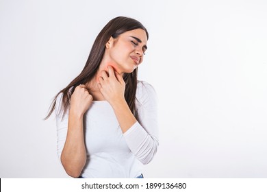 Young woman suffering from itching on her skin and scratching an itchy place. Allergic reaction to insect bites, dermatitis, food, drugs. Health care concept. Allergy rash