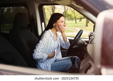 Young Woman Suffering From Nausea In Car