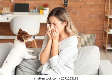 Young woman suffering from pet allergy at home