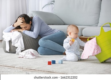 Young woman suffering from postnatal depression at home
