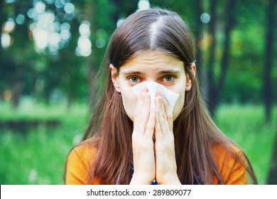 Young Woman Suffering Spring Pollen Allergy 