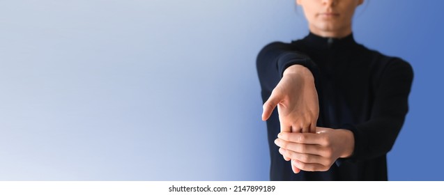 Young Woman Suffering From Wrist Pain, Provide Basic Stretch Excercise Against Pain. Holding Right Hand Out In Front. Stretching Forearm Before Exercising. 