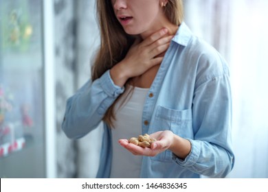 Young Woman Suffers From Choking And Cough From Peanut Allergy. Danger Of Food Allergy 