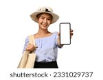 Young woman in summer hat and casual clothes, showing mobile phone in hand with empty screen