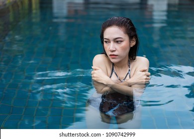 Young Woman Is Swimming In A Cold Plunge Pool 