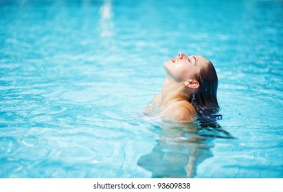 Young woman in the swimming pool