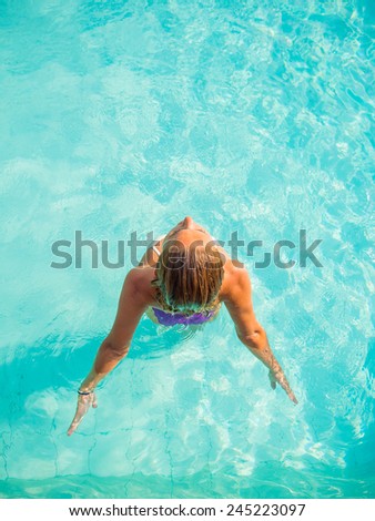 Young woman at the swimming pool