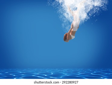 Young Woman Swimming Underwater In The Swimming Pool