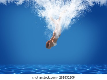 Young woman swimming undewater in the swimming pool