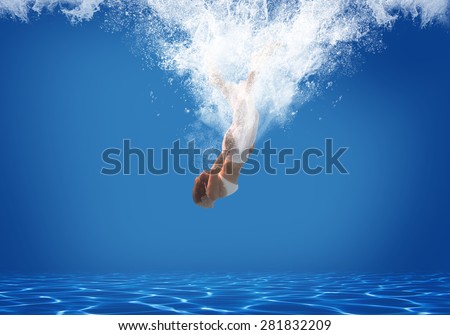 Young woman swimming undewater in the swimming pool