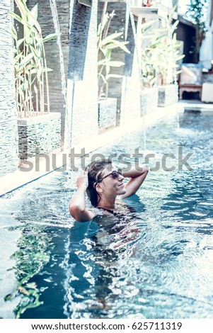 Similar – Rückansicht einer blonden Frau  im Infinity Pool