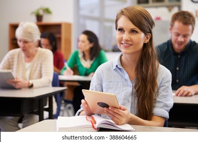 Young Woman With Tablet Computer At An Adult Education Class