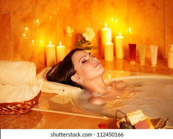 Young Woman Take Bubble  Bath With Candle.